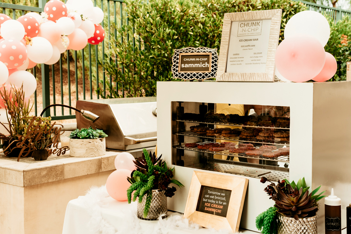 Chunk-N-Chip ice cream sammich station decorated with pink balloons at a birthday party